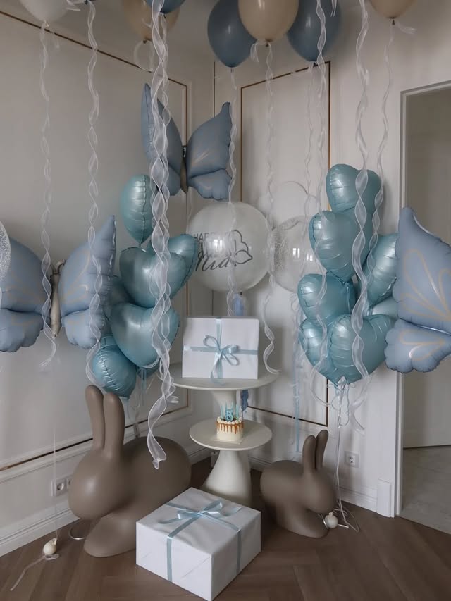 Blue butterfly balloon arch setup for a child birthday party